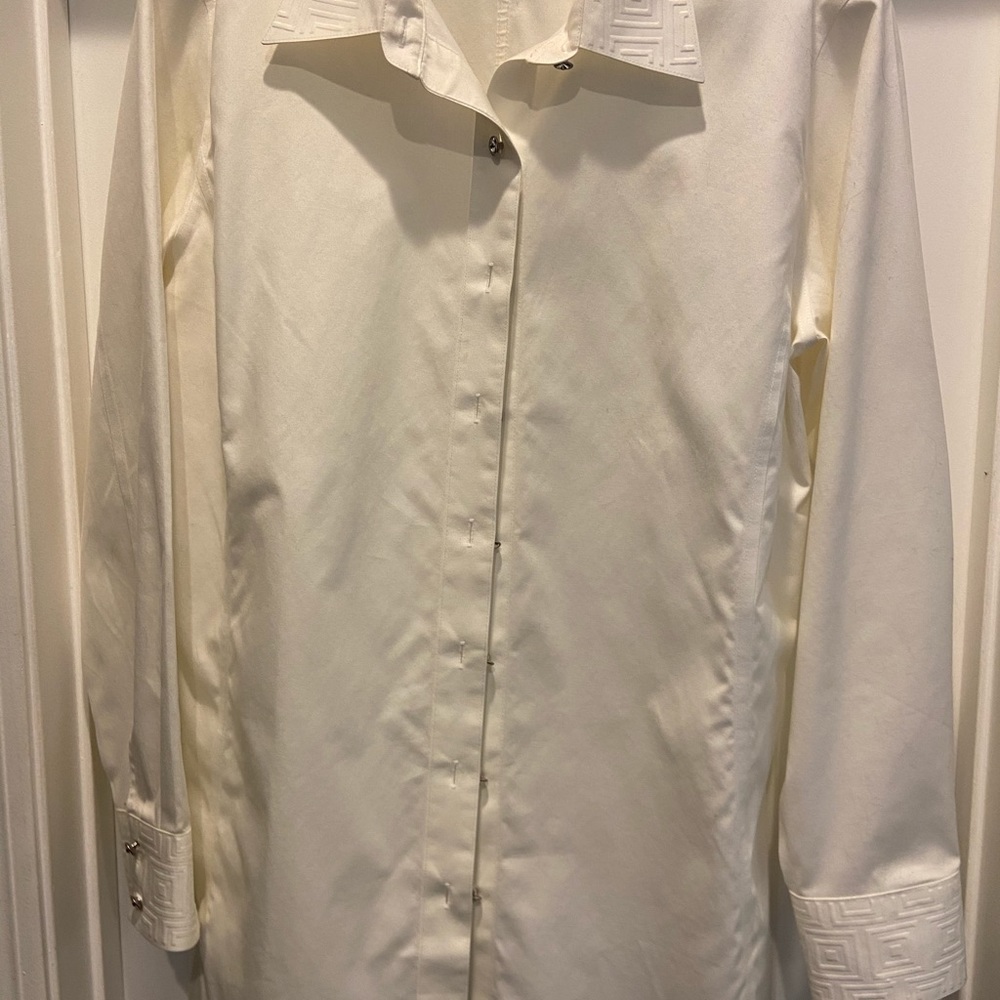 Dressy top with embellished cuffs and collar.